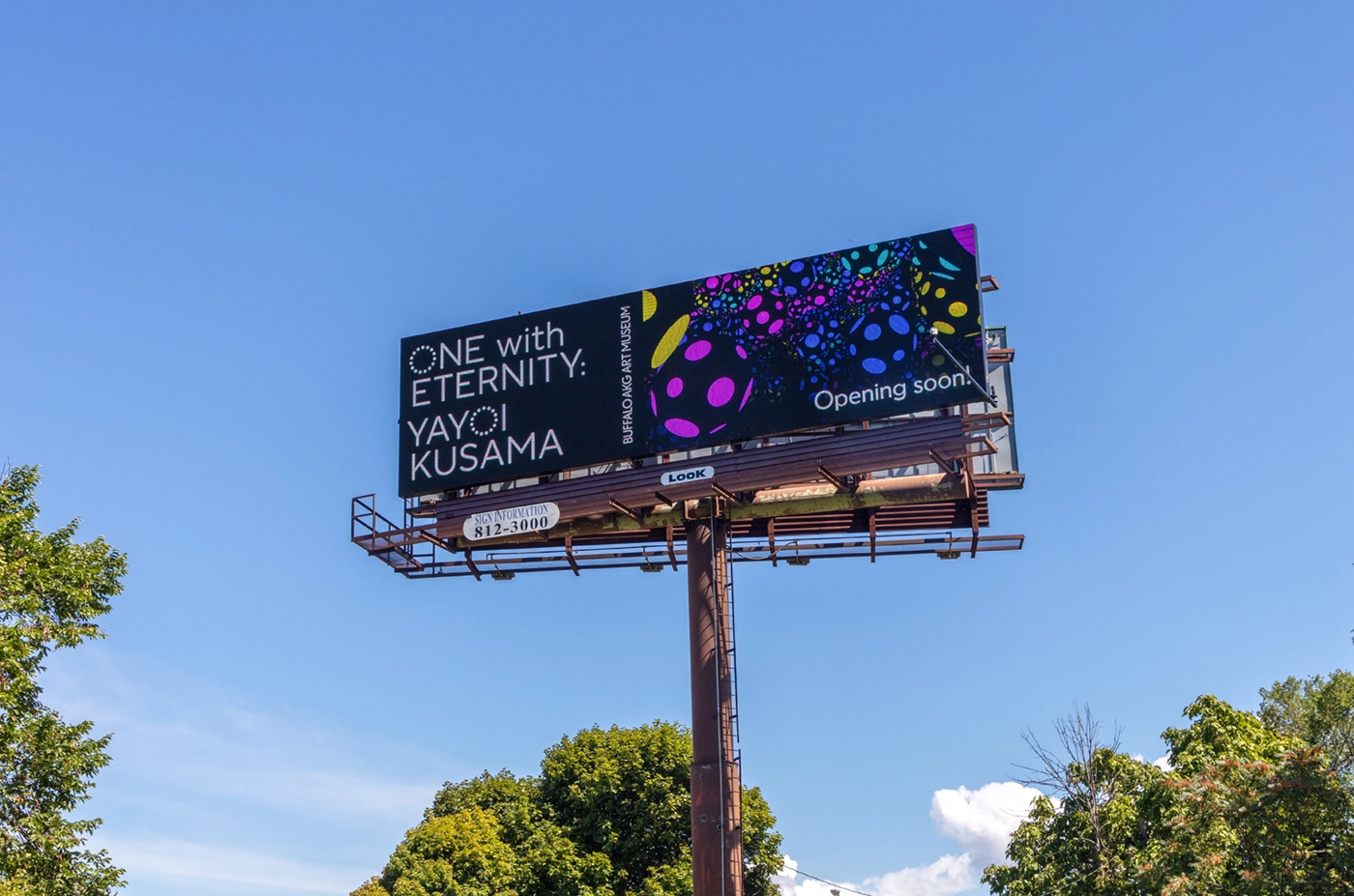 Large-scale highway billboard in Buffalo, New York advertising One with Eternity: Yayoi Kusama 